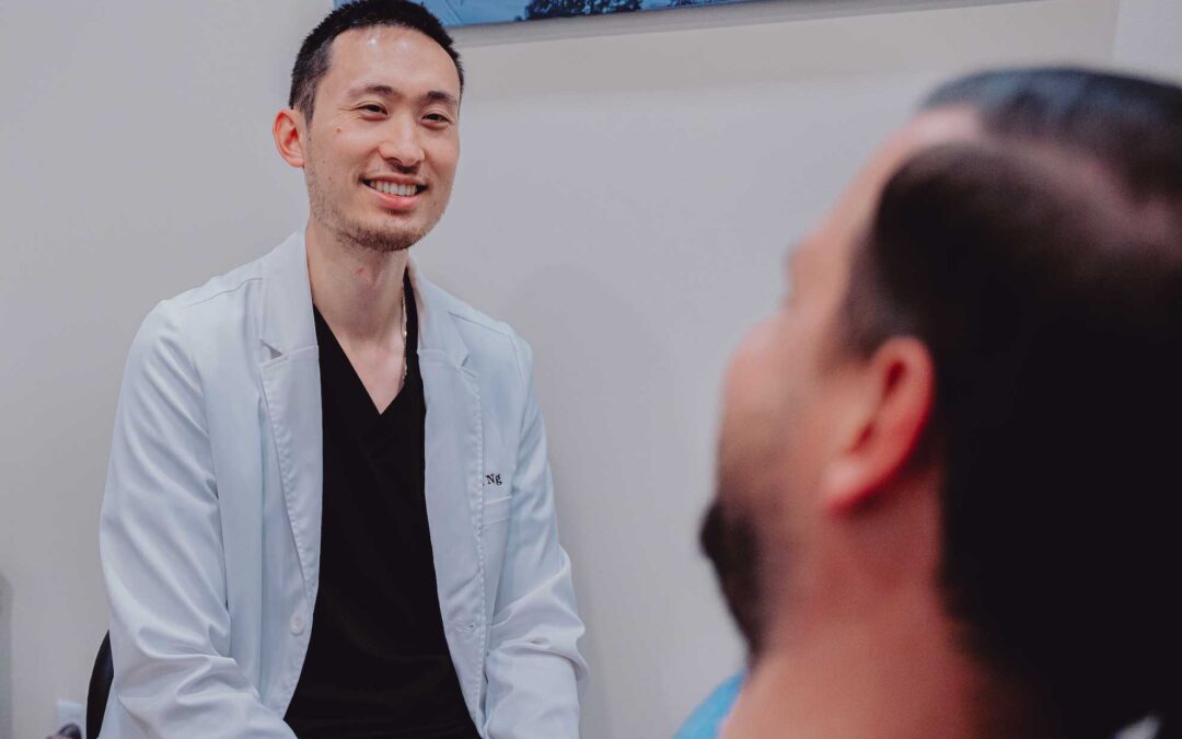 Dentist consulting patient at Hometown Smiles Dentistry in League City, TX