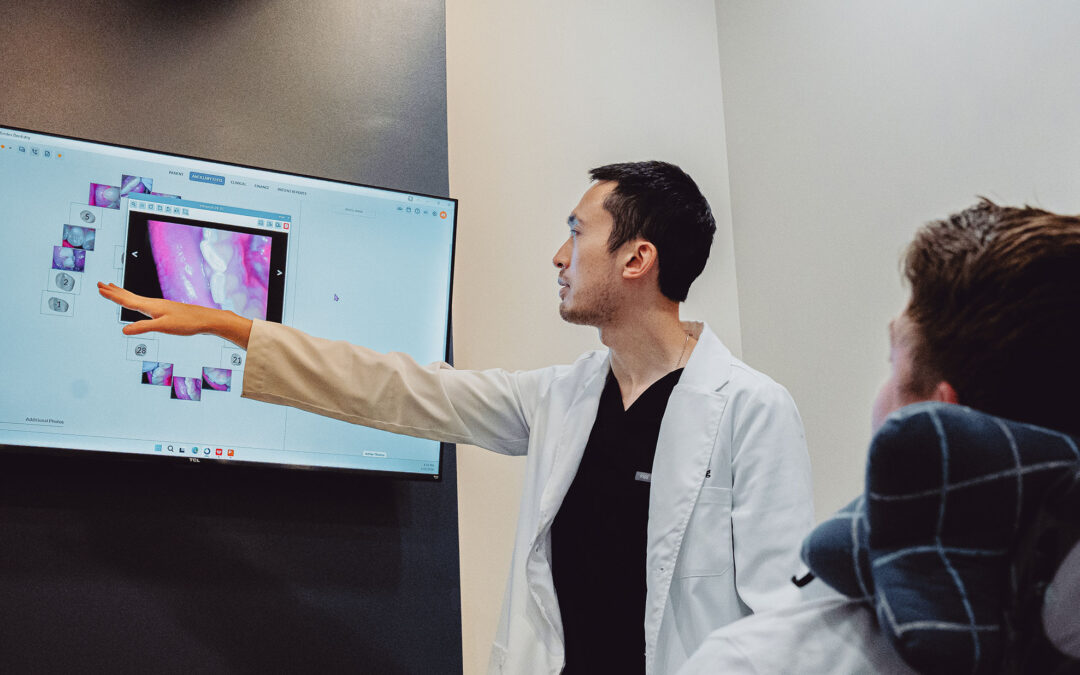 Dentist explaining dental X-rays at Hometown Smiles Dentistry in League City, TX
