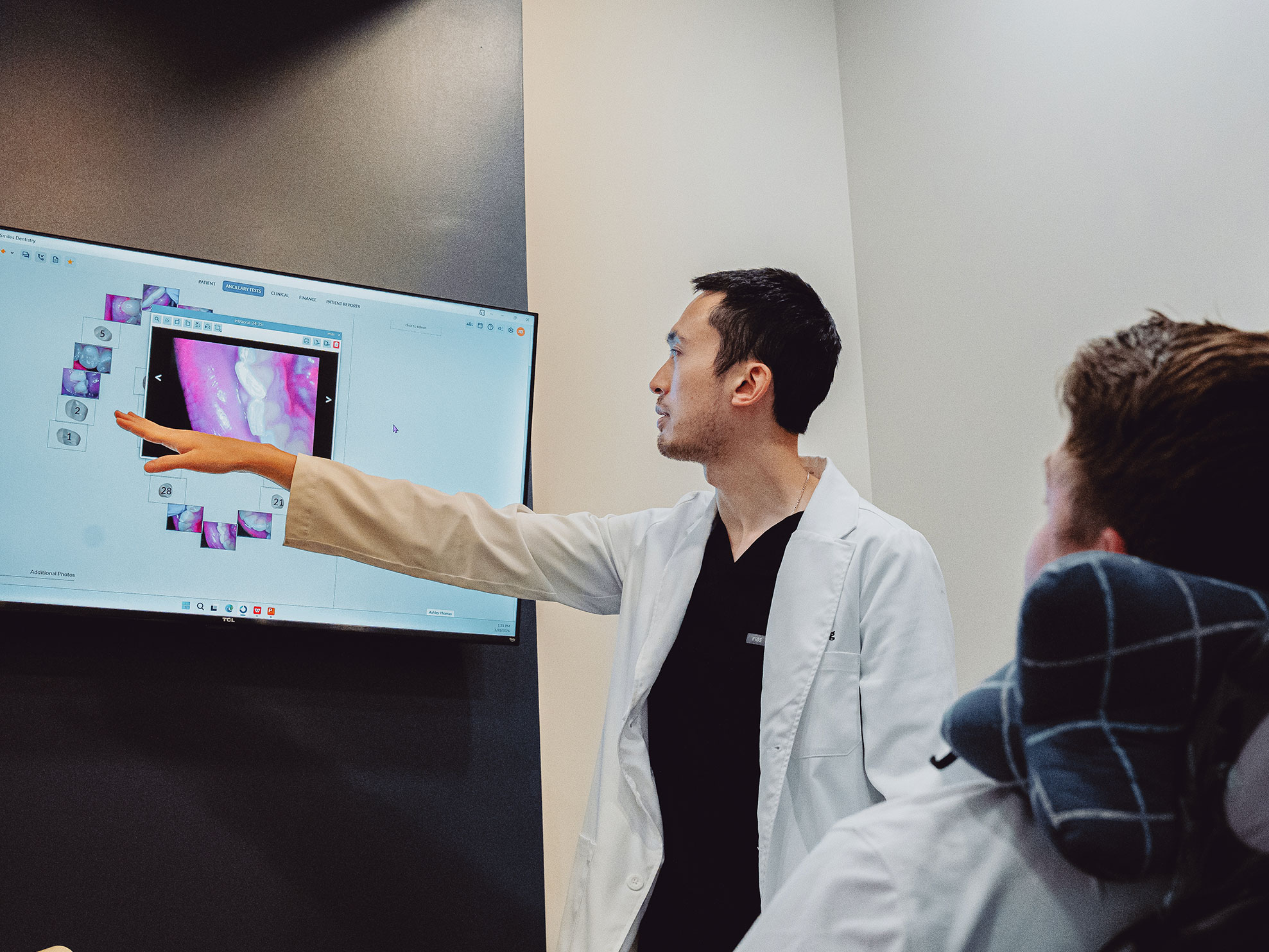 Dentist explaining dental X-rays at Hometown Smiles Dentistry in League City, TX